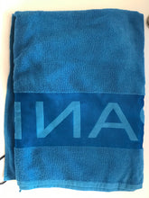 Load image into Gallery viewer, New Panerai large blue beach towel in travel storage bag
