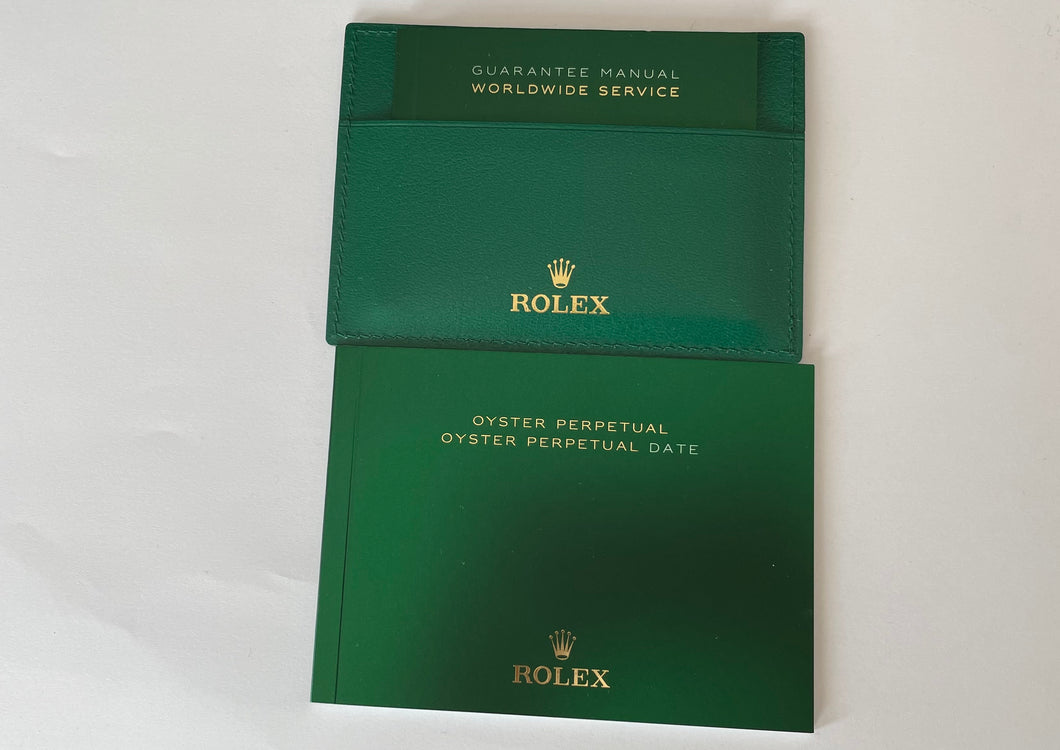 New Rolex Oyster Perpetual booklet set with guarantee manual and leather holder